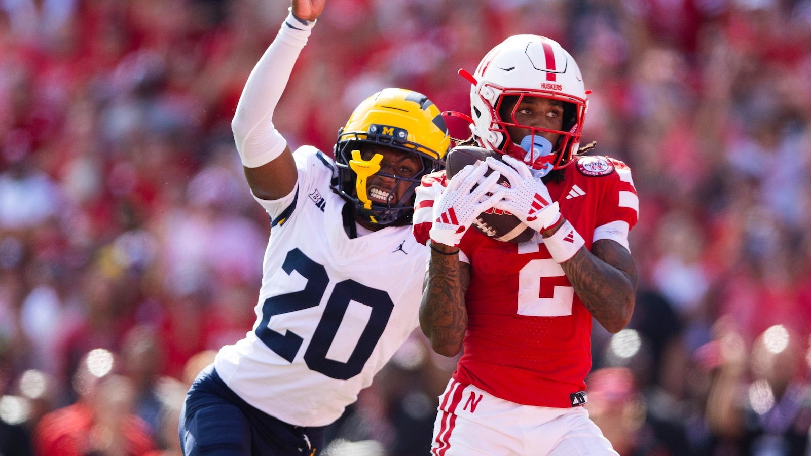No. 21 Michigan uses 3 long TD runs to beat Nebraska 30-27, extend Huskers' skid against Top 25 foes